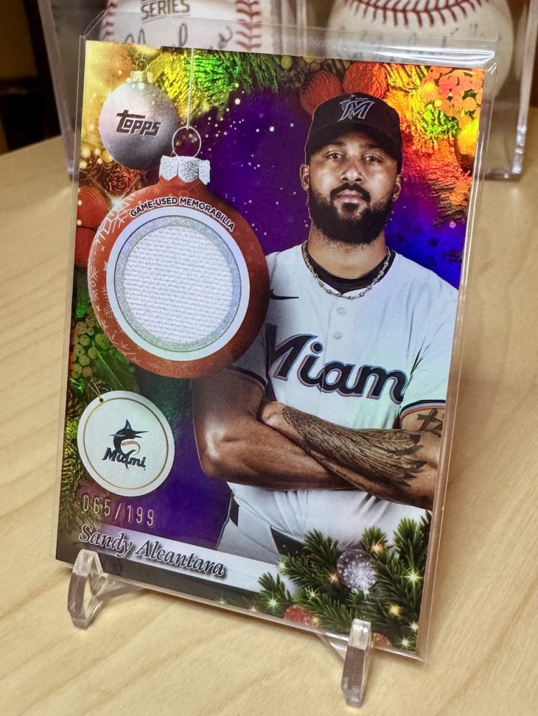2025 Topps Holiday #PR-SA Sandy Alcantara Game Used Purple Relic /199 reflection