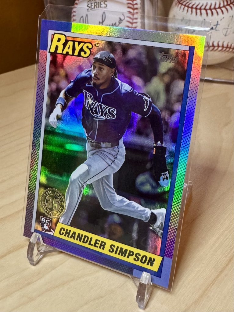 2025 Topps Update Series #U90-6 Chandler Simpson Rookie 1990 35th Anniversary Rainbow Foil reflection